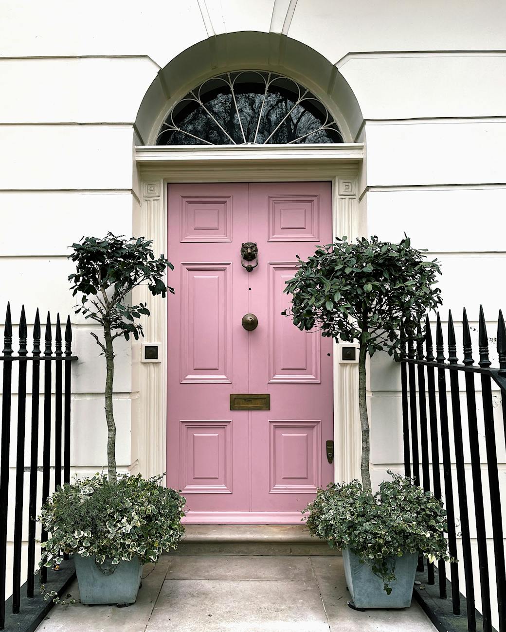 pink entrance door in old building